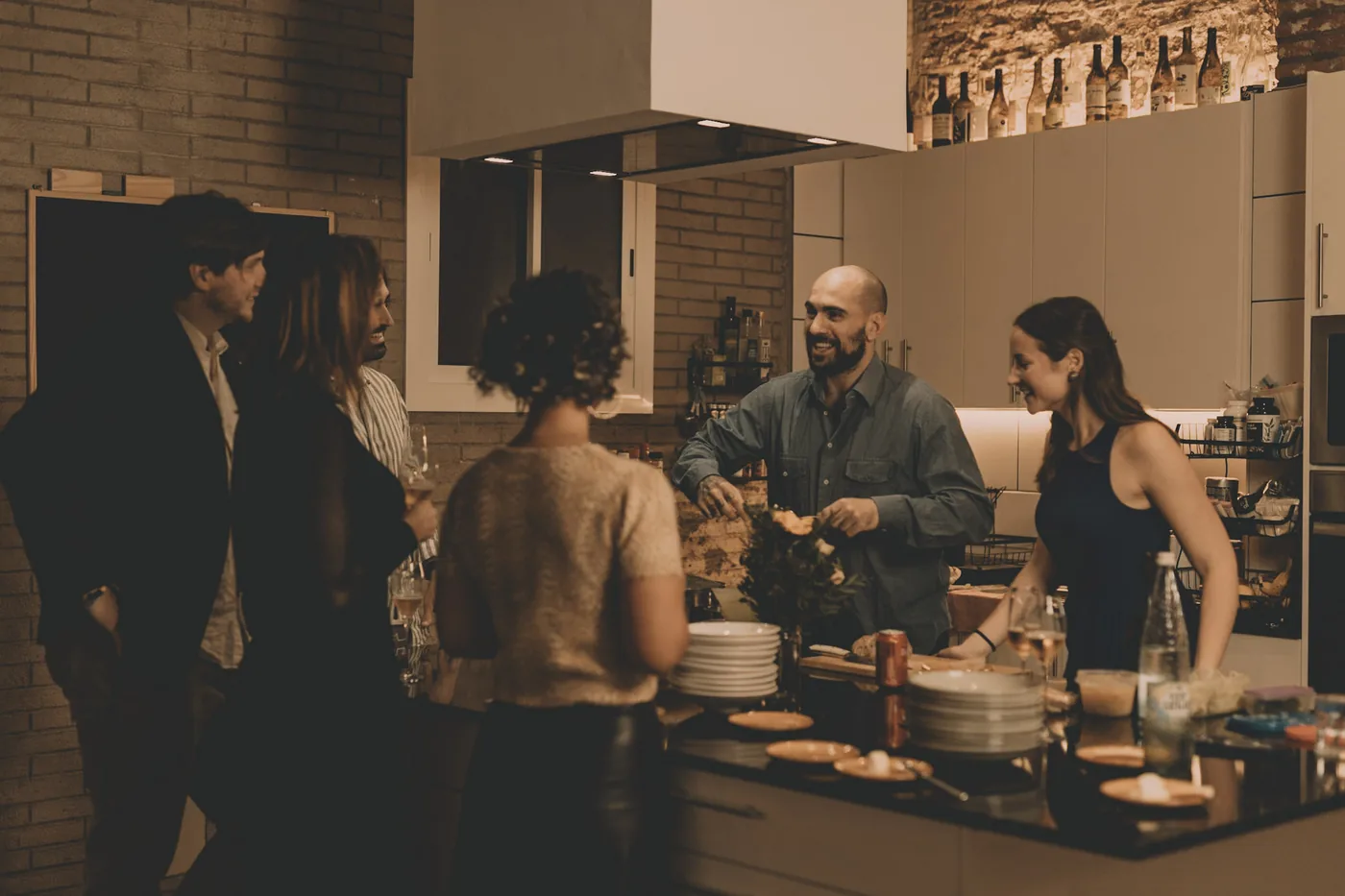 Riccardo cooking for guests in the open kitchen